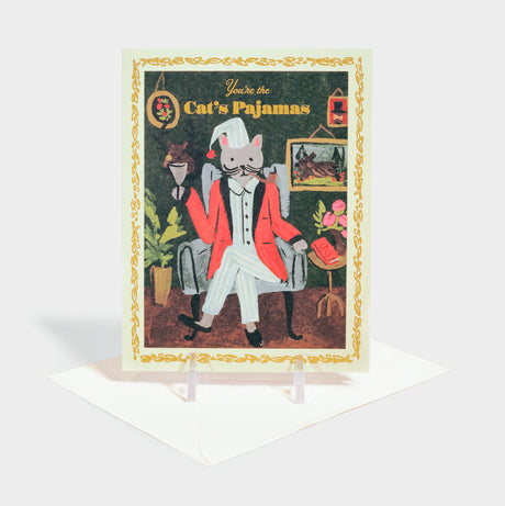 Greeting card with illustration of a cat sitting in an armchair wearing pajamas.