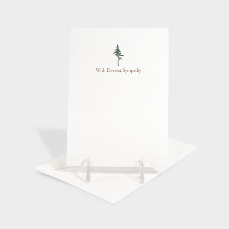 Greeting card with evergreen tree motif.