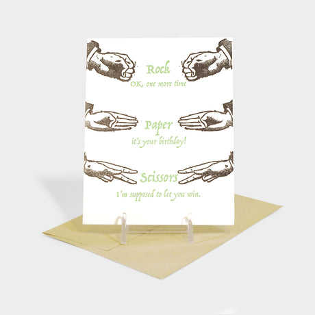 Greeting card with hands playing rock, paper, scissors.