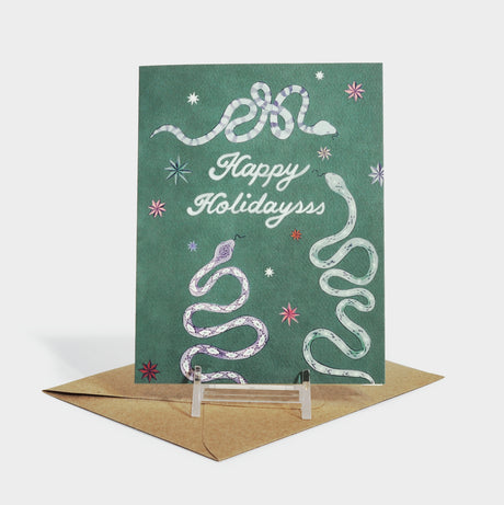Greeting card with illustrated snake and star motifs.