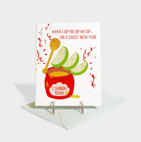 Greeting card with illustrated honey jar and apple slices.