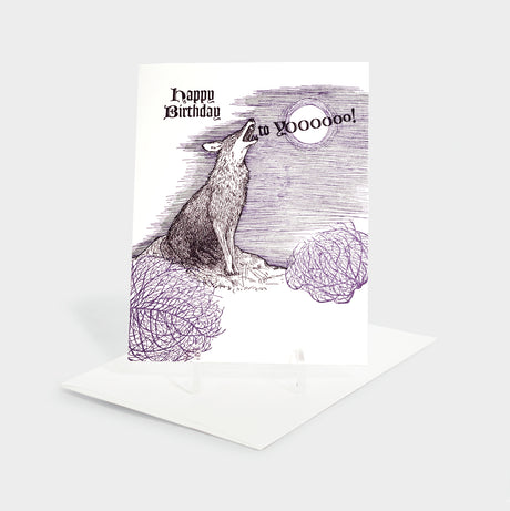 Greeting card with illustration of a howling coyote and tumbleweeds.