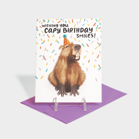 Greeting card with a capybara smiling.