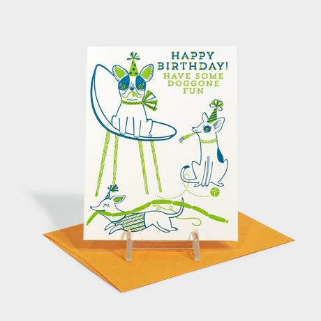 Letterpress card with dogs in party hats.