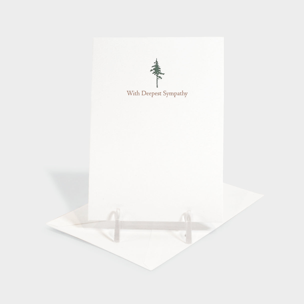 Greeting card with evergreen tree motif.