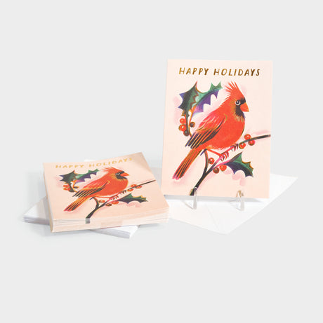 Greeting cards with an illustrated red cardinal and mistletoe. Features gold foil stamped text and accents.