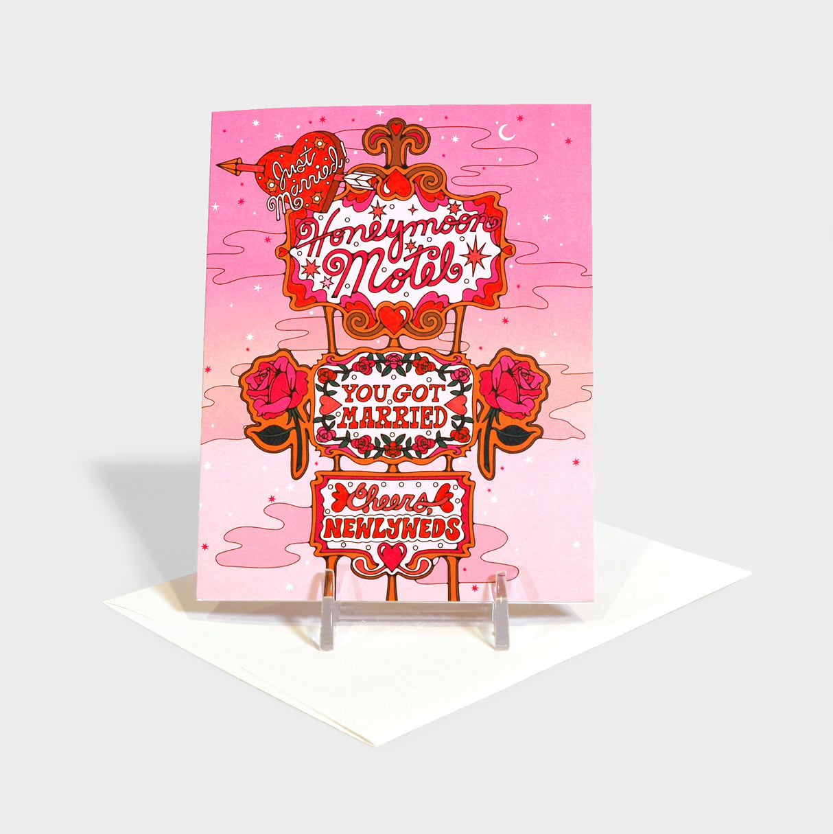 Greeting card with illustration of a "honeymoon motel" signage decorated with hearts and roses.