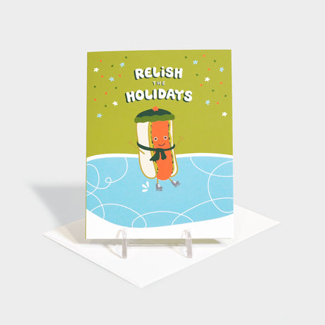 Greeting card with a happy hot dog in a beanie and scarf.