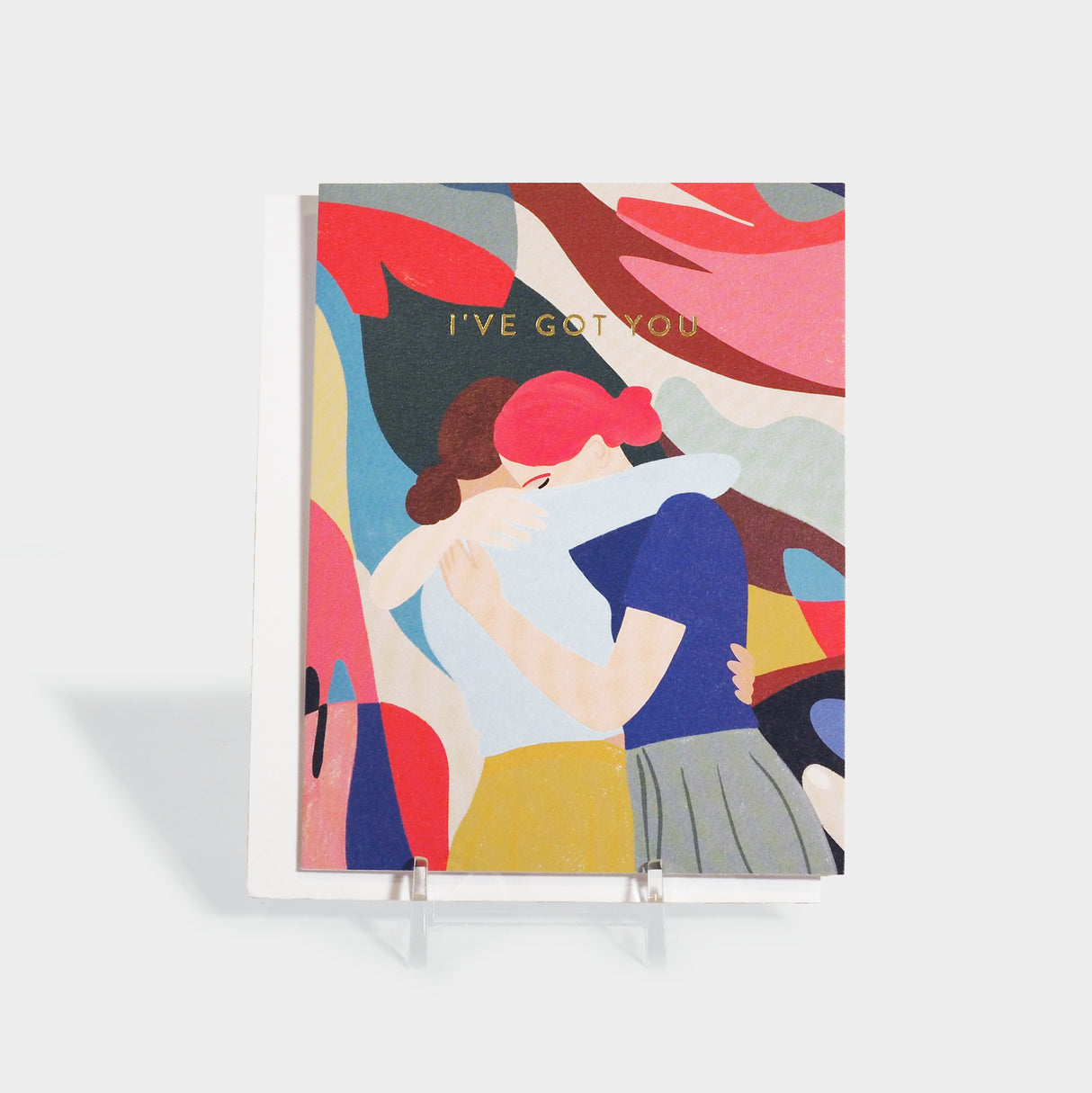 Greeting card with an illustration of two women embracing.