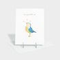 Greeting card with illustration of a baby chick in a bow.