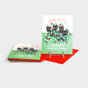 Greeting card set with black cats tangled up in holiday lights.