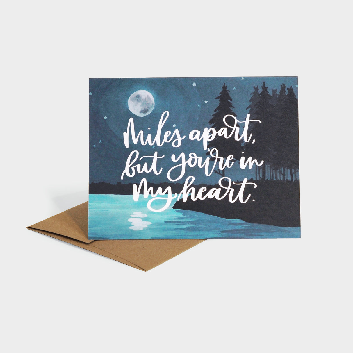 Greeting card with illustration of a moonlit lake.