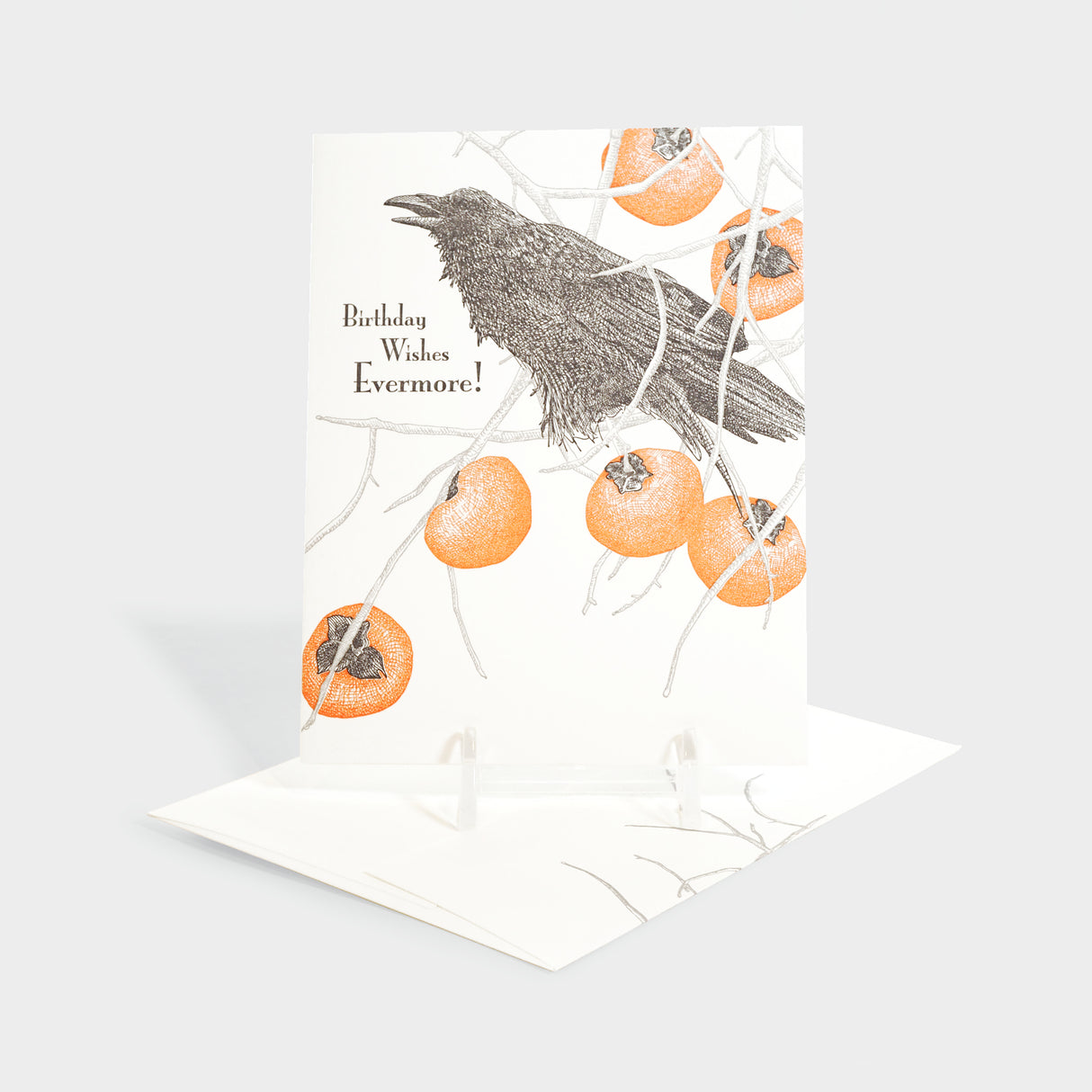Greeting card with raven and persimmon motifs.