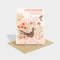 Greeting card with roadrunner in front of a desert vista motif. Features foil stamped details.