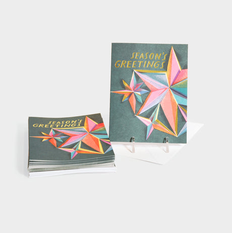 Greeting cards with colorful star motifs and gold foil stamped accents.