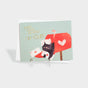 Greeting card with a cat inside a mailbox holding letters stamped with hearts.