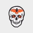 Die-cut, vinyl sticker featuring a skull with glowing orange eyes and a bat over the forehead.