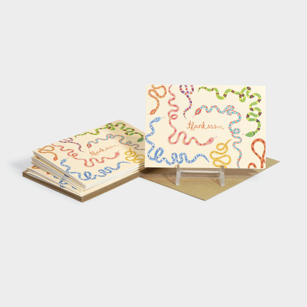 Greeting cards with illustrations of snakes. Text reads, "thankssss"