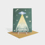 Greeting card with a UFO illustration and "peace on earth" appearing to abducted.